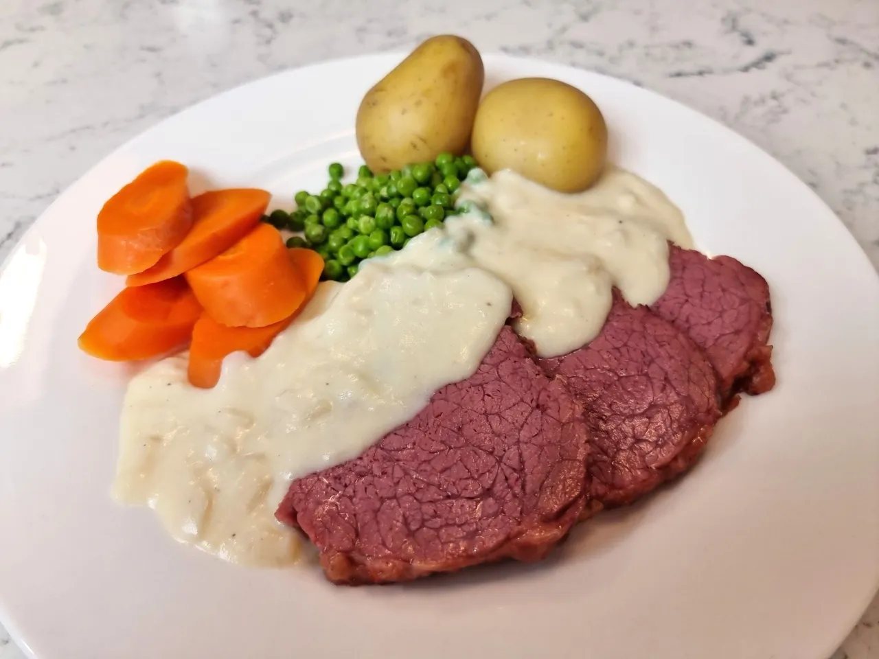 Silverside with boiled vegetables and white sauce