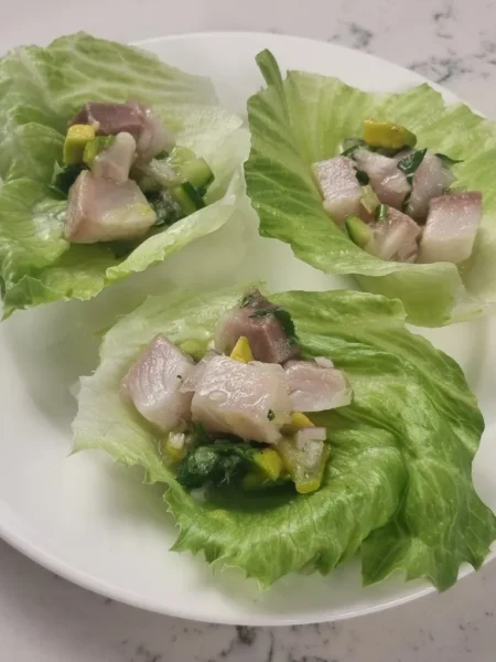 Serve lemon drop chilli kingfish ceviche in lettuce cups