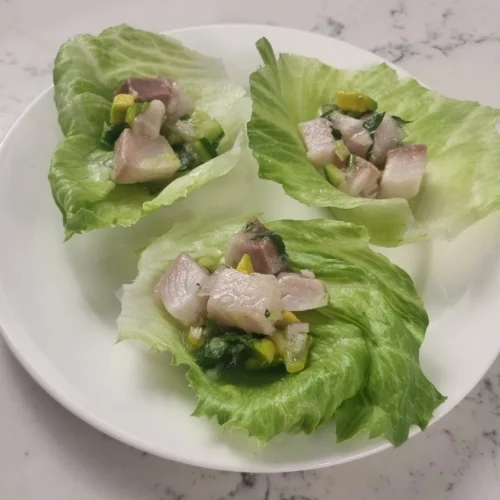 Serve lemon drop chilli kingfish ceviche in lettuce cups