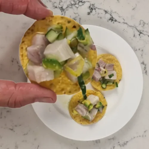 Serve lemon drop chilli kingfish ceviche on corn chips or tostadas